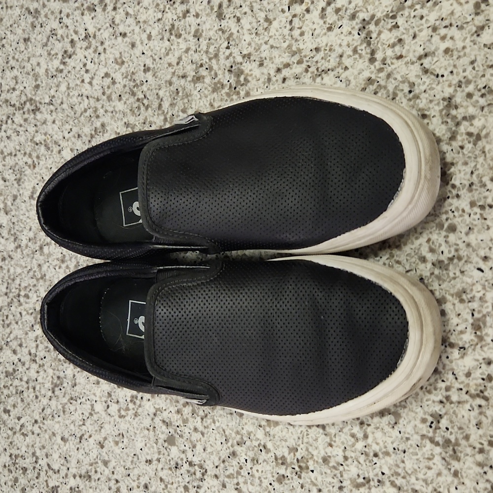 Van's black perforated leather slip-ons